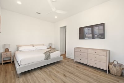 Slip into crisp linens after a sun-soaked day, let the ceiling fan whisper you to sleep, and wake up rested for another beach adventure.