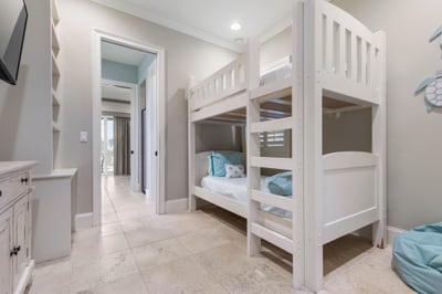 Whispers and giggles fill the bunk room as kids climb into bed, still glowing from a day by the water.