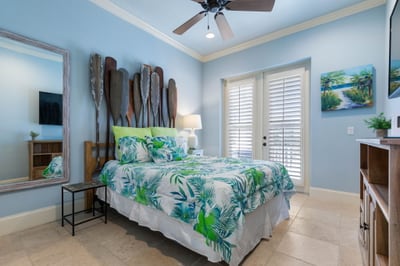 Bright with island blues and playful coastal charm, this cheerful bedroom is where beach days begin and family stories wind down.