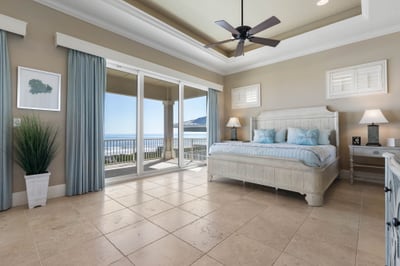 Morning begins with ocean light pouring through the doors as you step onto the balcony, coffee in hand and waves rolling below.