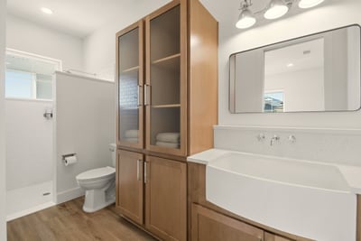 After a day of salt air and sunshine, this spa-like bath welcomes the family home with bright finishes, soft towels, and room to reset.