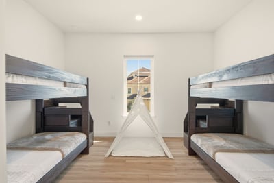 Tucked between beach adventures and bedtime stories, this cheerful bunk room gives kids a place to laugh, whisper, and make their own vacation magic.